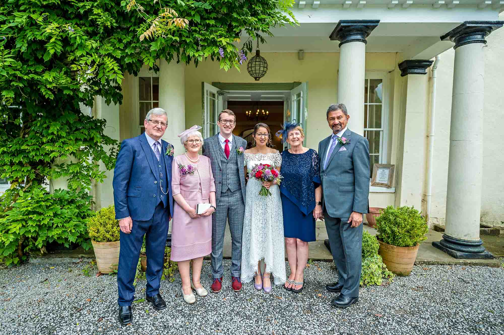 Newly-weds with parents outside Plas Glansevin, Carmarthenshire