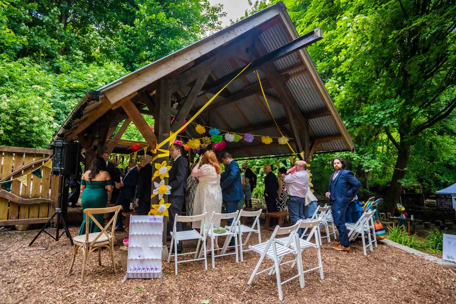 Guests congregating at an Underwood Centre wedding in Arnos Vale for the bride's arrival.