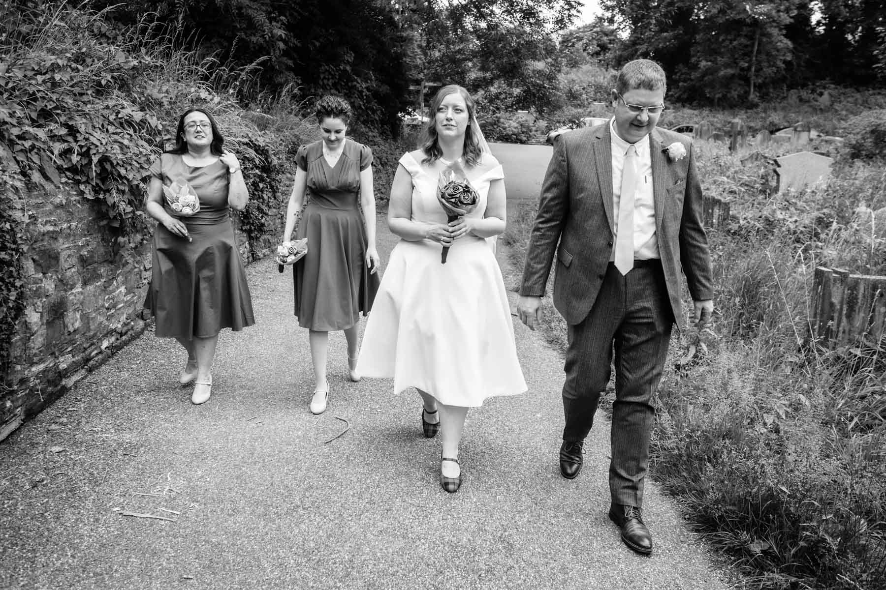 The walk from where the car drops the bridal party to the Underwood Centre is about 4 minutes. I take time to photograph the bridal procession.