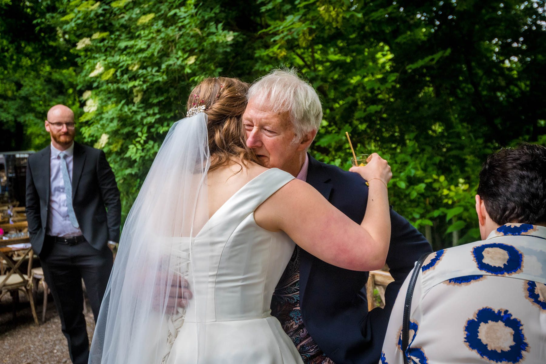 Bride hugs an elderly relative at her Arnos Vale wedding.