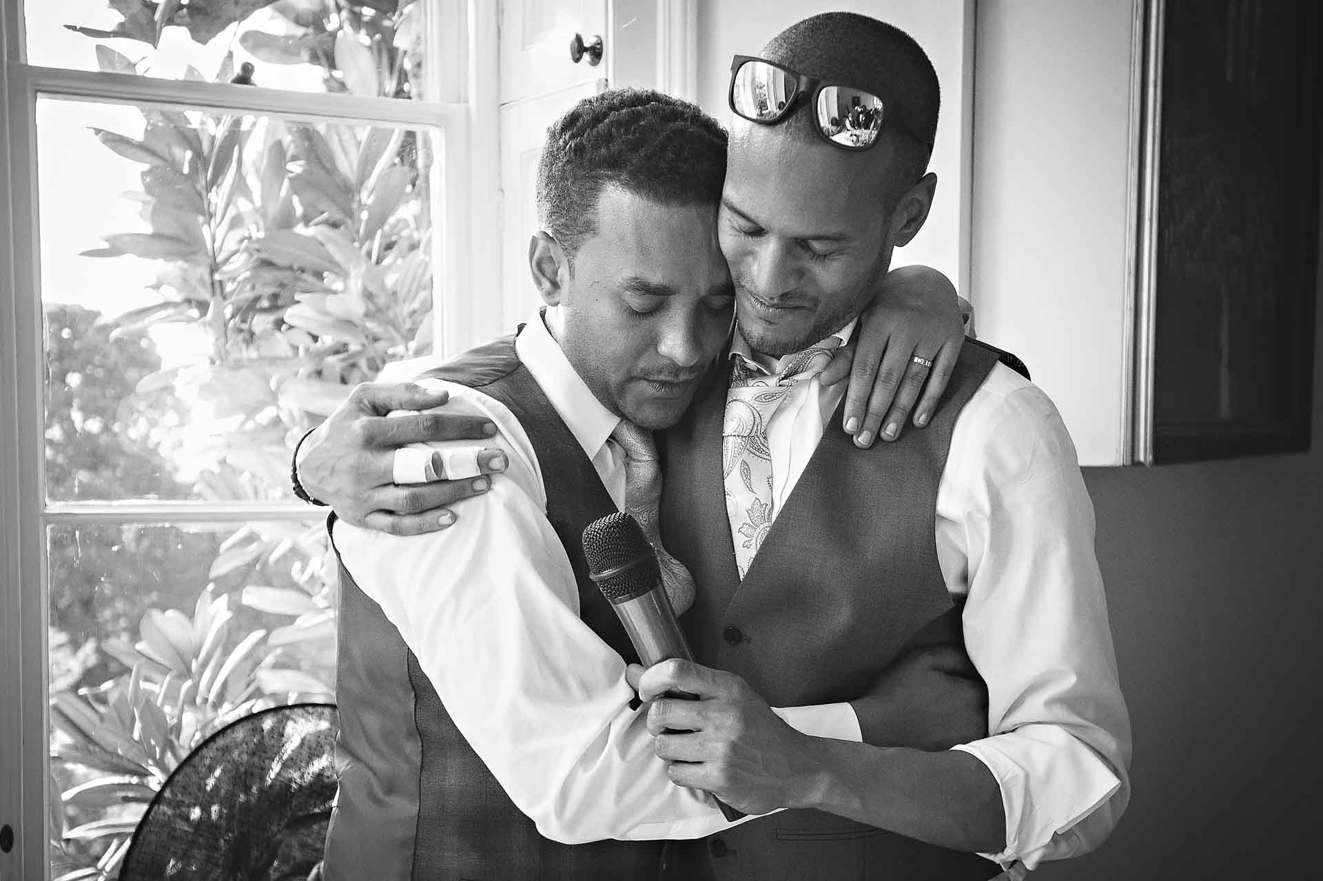Best Man & Groom Hugging at Wedding
